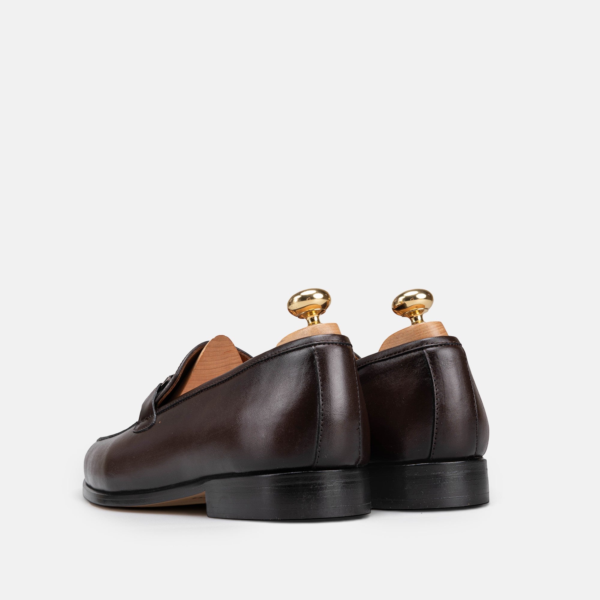VOLZAK brown leather loafers with wooden shoe trees, back view showing smooth leather construction
