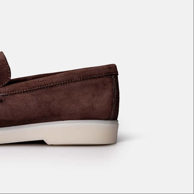 VOLZAK brown suede moccasin with a white rubber sole, side view showing detailed stitching