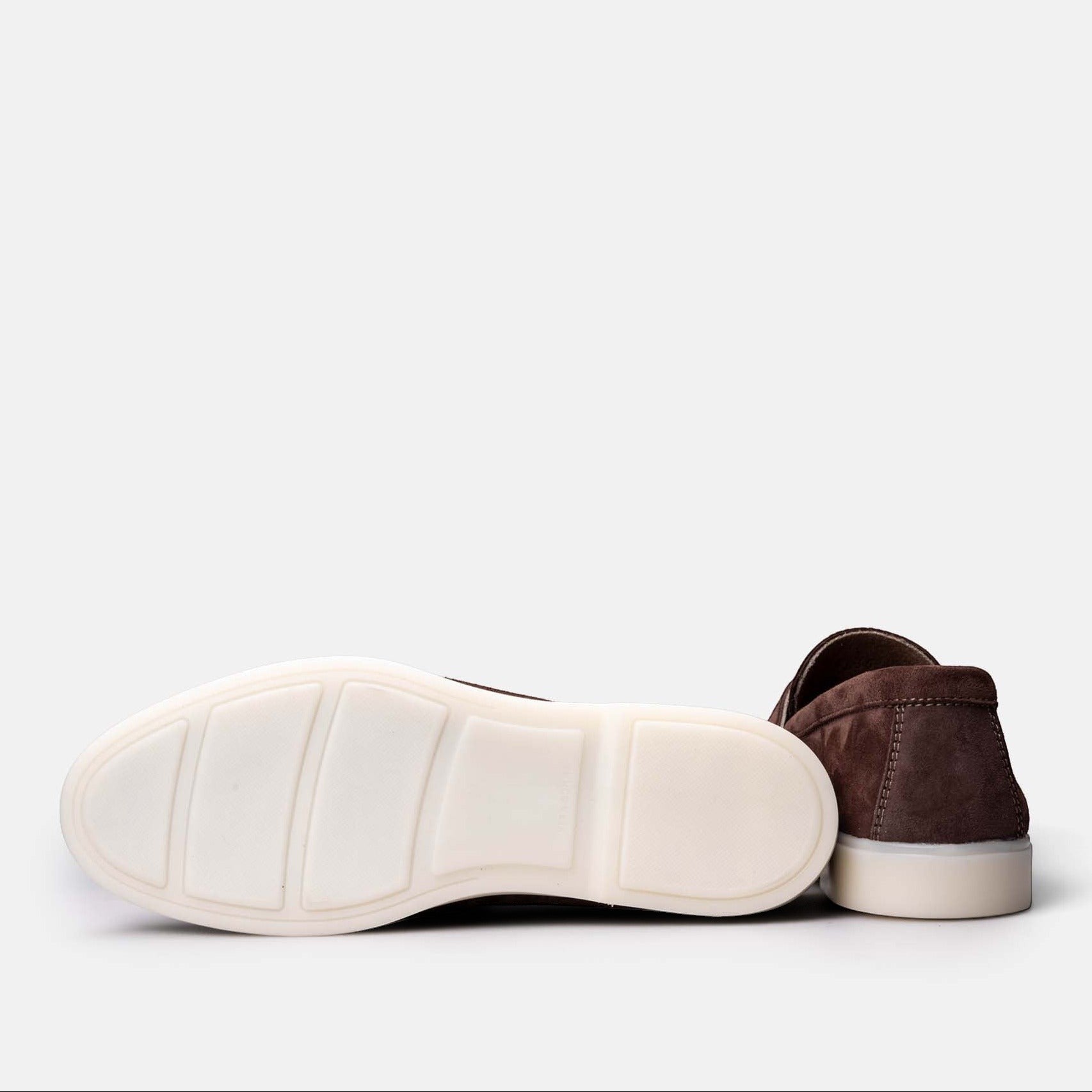 VOLZAK brown suede moccasins with white rubber soles viewed from the side and bottom