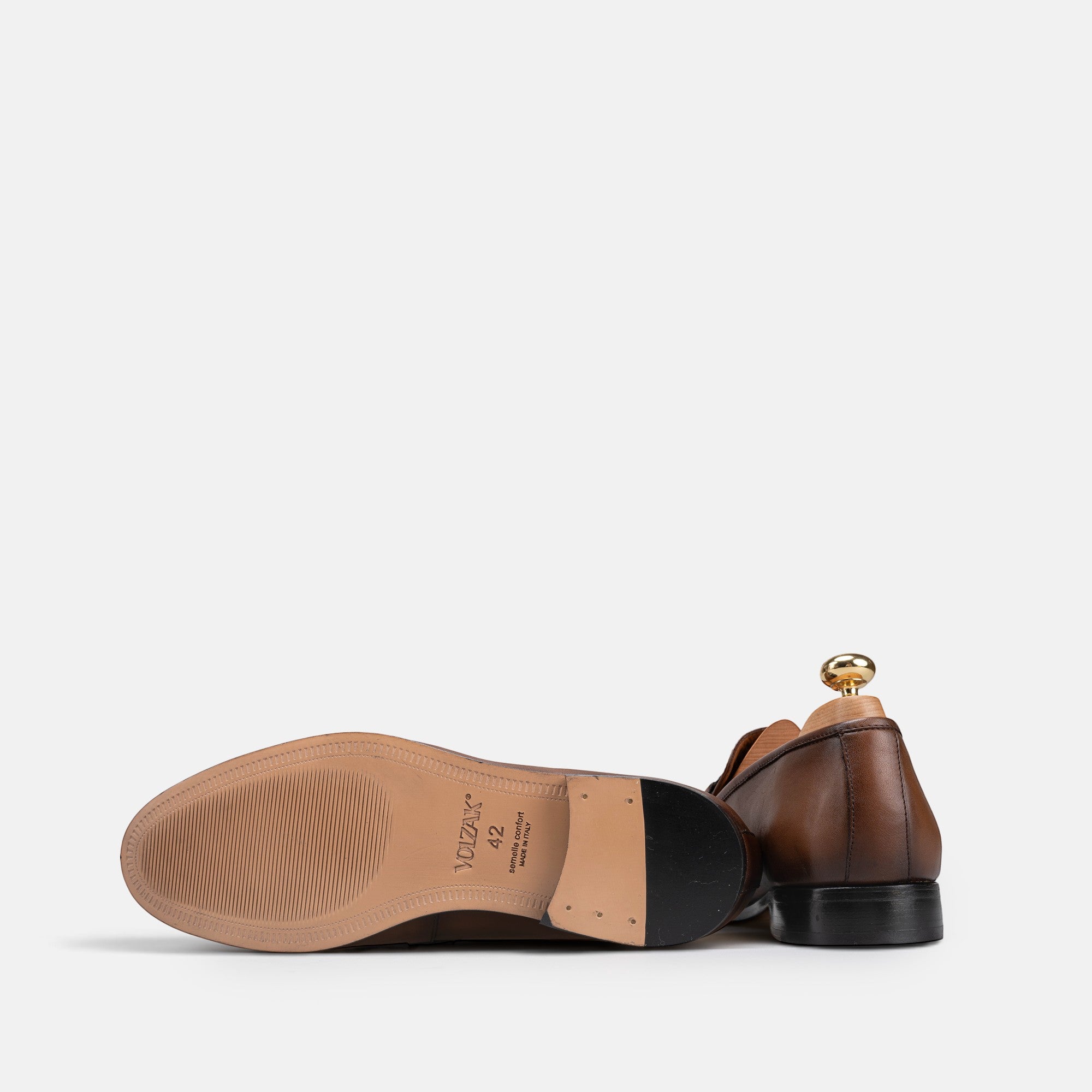 VOLZAK brown vintage leather dress shoe showing the sole and heel detail on a white background