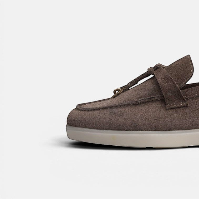 VOLZAK 279 moccasin in dark taupe suede with leather lining and a durable rubber sole, side view.