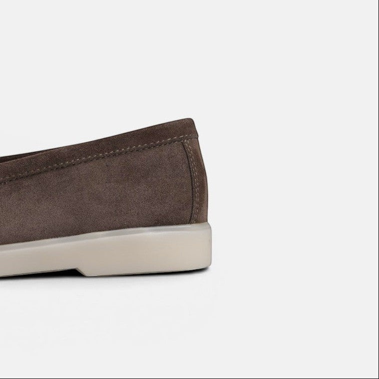 VOLZAK dark taupe suede moccasin with a durable rubber sole, side view showing heel detail.