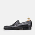 VOLZAK black leather loafer with silver metal bit detail and wooden shoe tree, side view