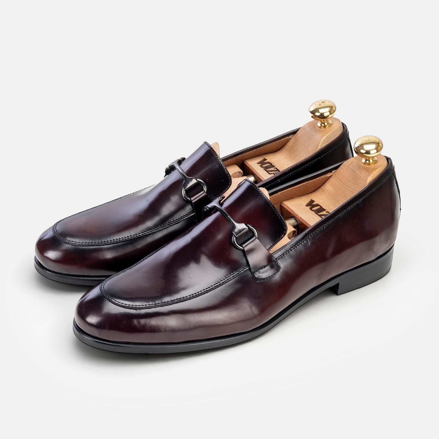 VOLZAK bordeaux leather loafers with a polished finish and metal bit detail, featuring leather soles and shoe trees.