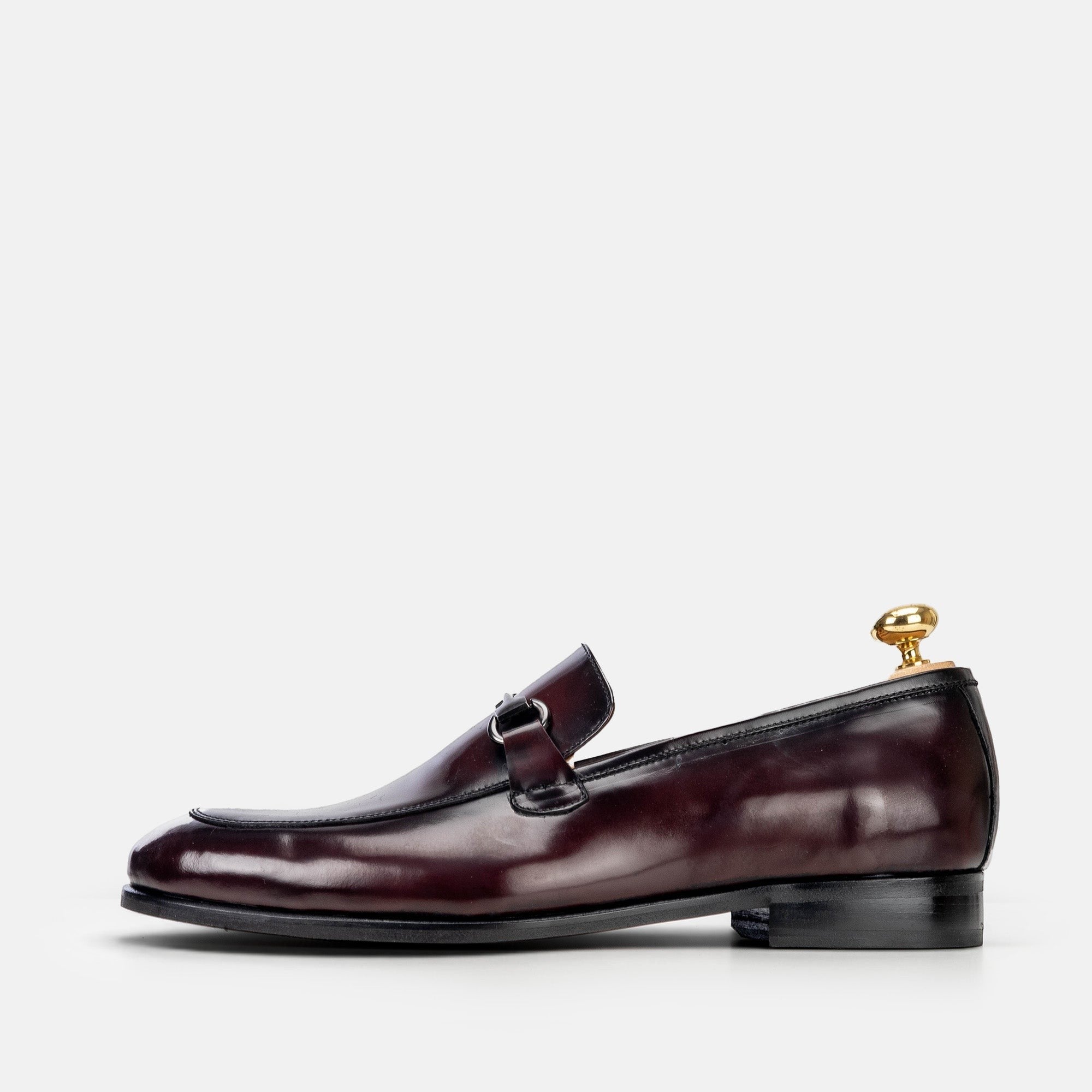 VOLZAK bordeaux leather loafer with a metal bit detail and leather sole, side view