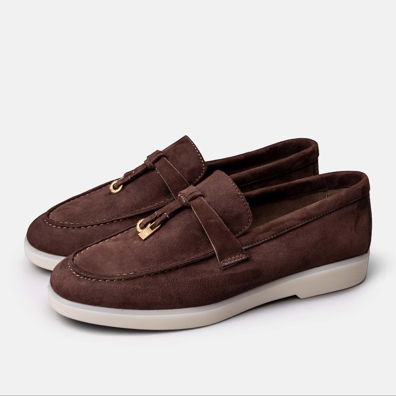 VOLZAK brown suede moccasins with gold-tone hardware detail and a white rubber sole