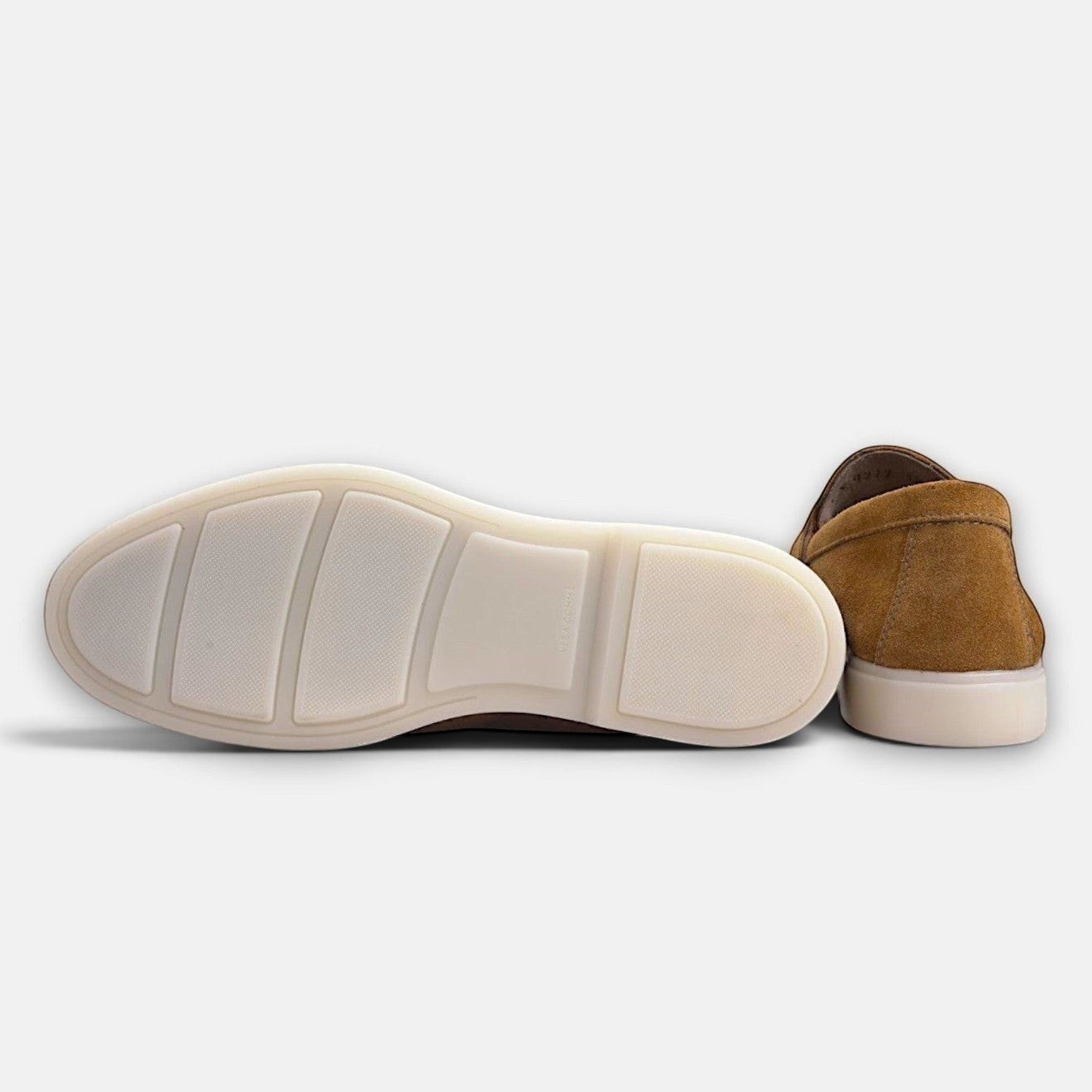 VOLZAK camel suede moccasin showing the white rubber sole and heel detail against a plain background