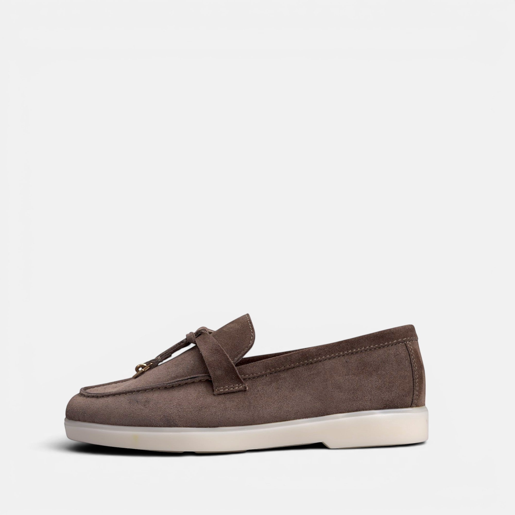 VOLZAK dark taupe suede moccasin with tassel detail and white rubber sole, side view