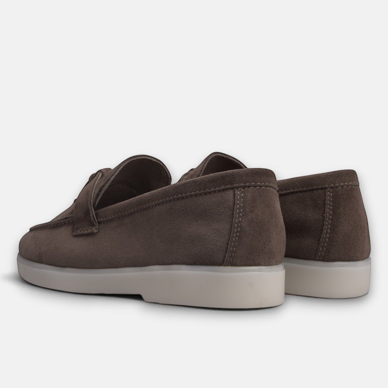 VOLZAK dark taupe suede moccasins with a white rubber sole, viewed from the back