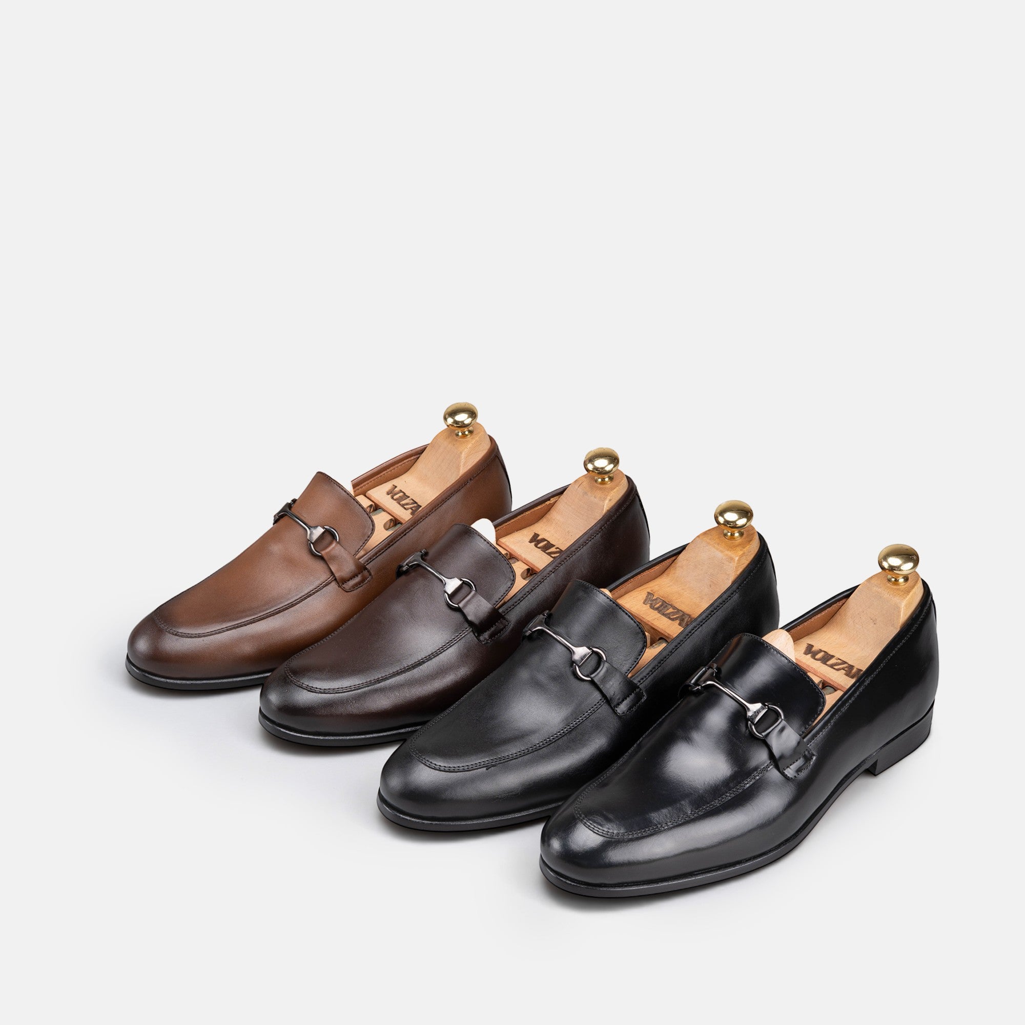 VOLZAK leather loafers in brown and black shades with metal bit detail and wooden shoe trees